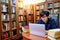 Asian man student using laptop in college library