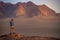 Asian man traveler in Wadi Rum desert, Jordan