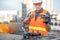 Asian man using drone and laptop for construction site survey