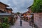 An Asian man walking alone on Ninenzaka in the morning, famous ancient street in Kyoto