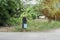 Asian man watering his garden.