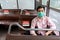 Asian man wear protective mask make social distancing for  shuttle bus during CoVID-19. New normal behavior lifestyle in daily