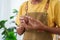 Asian man wearing apron for cooking prevent dirty clothes, man standing with knife peel vegetables, potatoes, In order prepare it