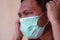 Asian man wearing medical face mask, covid-19 pandemic illustration