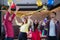 ASian man and woman wear santa claus hat having fun in Christmas party,dancing and playing balloons at the restaurant,