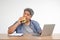 Asian man working and eating a burger on the office desk. Concept of a busy businessman cannot work-left balance and not taking