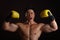 Asian Man with yellow boxing gloves posing