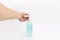 Asian mand hand holds a gel alcohol pump bottle and ready to pushes on it. It`s an  object on the white clear screen in