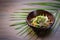 Asian marinated vegetable salad in a bowl on wooden table background. Traditional, fresh, vegetarian snack food