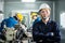 Asian mechanical workers working on milling machine. The technicians wearing protective glasses and helmet when operating the mach