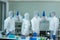 Asian medical scientists wearing protective suit and face mask  diagnosis vaccine virus in science clinical