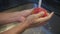 Asian men hands washing apple with pure water from tap. running water cleaning chemical on fruit peel. slow motion