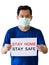 Asian men wear medical masks. Holding a Campaign Banner to Stay Home Stay Safe To Prevent the Outbreak of the Corona Virus That is