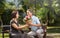 Asian middle-aged man gives a rose to his wife in valentine day