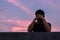 Asian miserable depressed man stay alone with sky background.