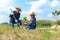 Asian mom and child girl plants sapling tree in the nature spring for reduce global warming growth feature and take care nature ea