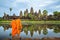 Asian  monk stand and look to Angkor wat in siem reap