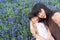 Asian mother with the beloved daughter in the blossoming lavender field