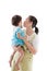 Asian mother carrying and soothe her daughter on white background