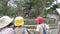 Asian mother and children walking for a field trip on vacation summer in the zoo. Childhood learning concept.