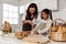 Asian mother and cute daughter, happy young mother teach cook together with small daughter doing bakery and learning to make cake