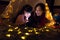 Asian Mother and daughter relax with tent and light in they bed room