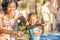 Asian Mother Encourage Toddler Having Fun at Swimming Pool