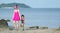 Asian Mother and female toddler child while walking in a beach resort