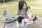 Asian Mother hold baby when family picnic in the park