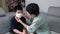 Asian mother putting mask on child`s face for protection from corona virus