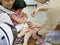 Asian mother`s hands hugging her daughter while recieving double vaccination