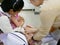 Asian mother`s hands hugging her daughter while recieving double vaccination