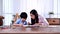 Asian mother work home together with son. Mom and kid drawing picture and color painting art. Woman lifestyle and family