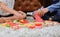 Asian mother work home together with son. Mom and kid play color wooden block. Child creating building toy.