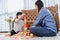 Asian mother work home together with son. Mom and kid play color wooden block. Child creating building toy. Family lifestyle