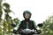 Asian motorcycle taxi rider rushing