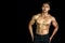 Asian muscle men posing muscle front on the black background. Body gym big chest and shoulder and bicep. Healthy fitness body type