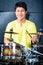 Asian musician drummer in recording studio