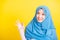 Asian Muslim Arab woman Islam wear hijab smile she showing gesture fingers in okay gesture symbol