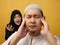 Asian muslim couple husband and wife having fight, argue and screaming on each other, bad relationship in marriage