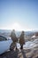 asian muslim couple standing and enjoying the view of beautiful cappadocia