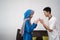 Asian muslim family sibling shake hand in idul fitri eid mubarak