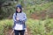 Asian muslim female farmer supervise her ginger plants cultivation. Organic farming