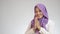 Asian muslim lady smiling and shows greeting gesture, concept of islamic celebration of ramadan or eid fitr