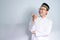 Asian Muslim man wearing glasses and white cloth smiling  pose for ramadhan