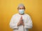 Asian muslim man wearing mask during coronavirus covid pandemic new normal, man wearing face protective mask doing greeting