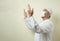 Asian Muslim man wearing mask praying