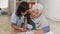 Asian muslim mother drawing with her daughter, single mom teaching baby girl, learning on the floor, happy family