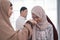 Asian muslim parent shake hand in idul fitri eid mubarak