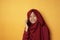 Asian Muslim Teenage Girl Smiling When Talking on Phone
